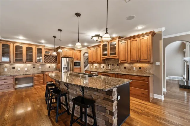 a dining table with chairs and wooden floor
