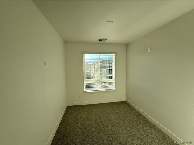 a room with a sink and a mirror