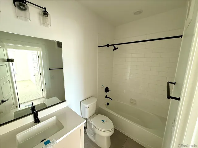 a bathroom with a sink a toilet and a bathtub