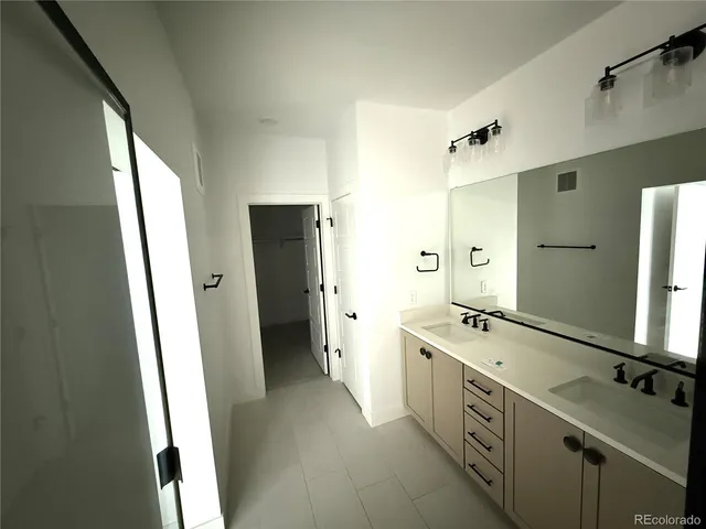 a view of a room with a white walls