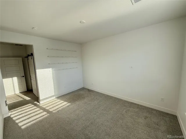 a front view of a building with a street