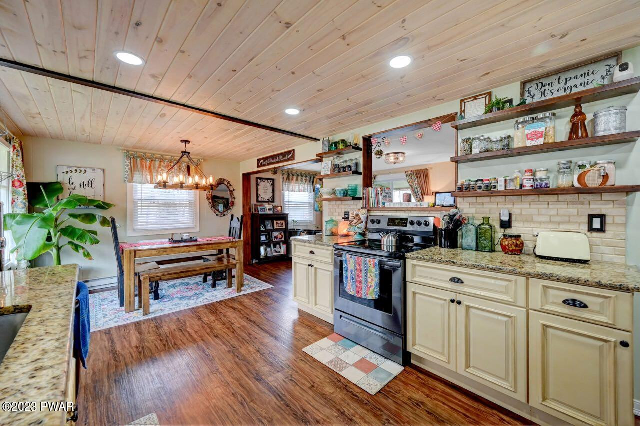 1597 Ridgeview Drive Lake Ariel, PA 18436 - Photo 11 of 92 a open kitchen with cabinets a stove and wooden floor
