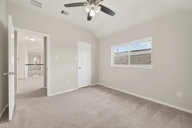 en empty room with fan and windows