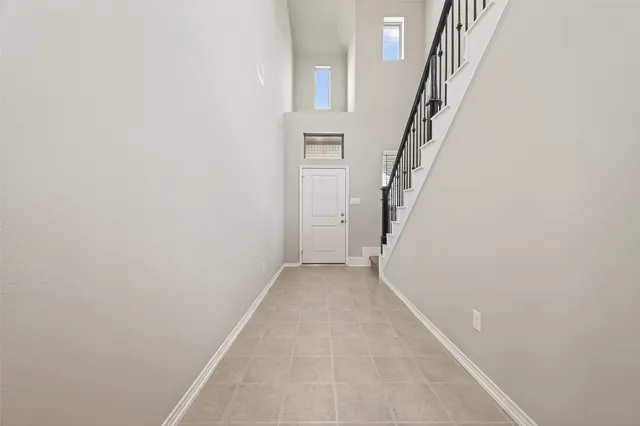 a view of a hallway with staircase
