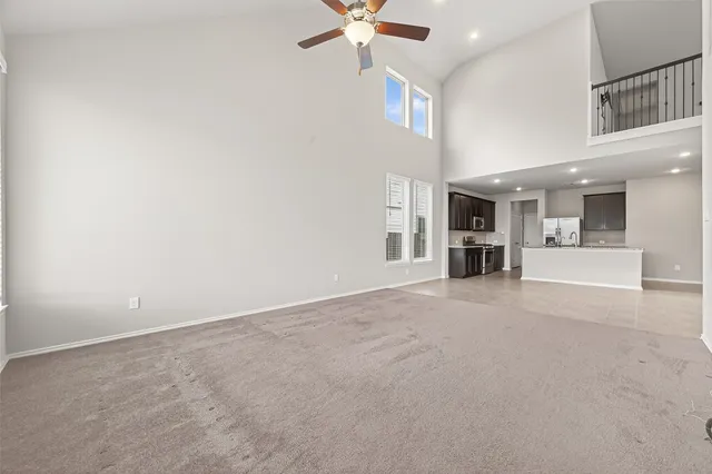a view of a livingroom with a kitchen