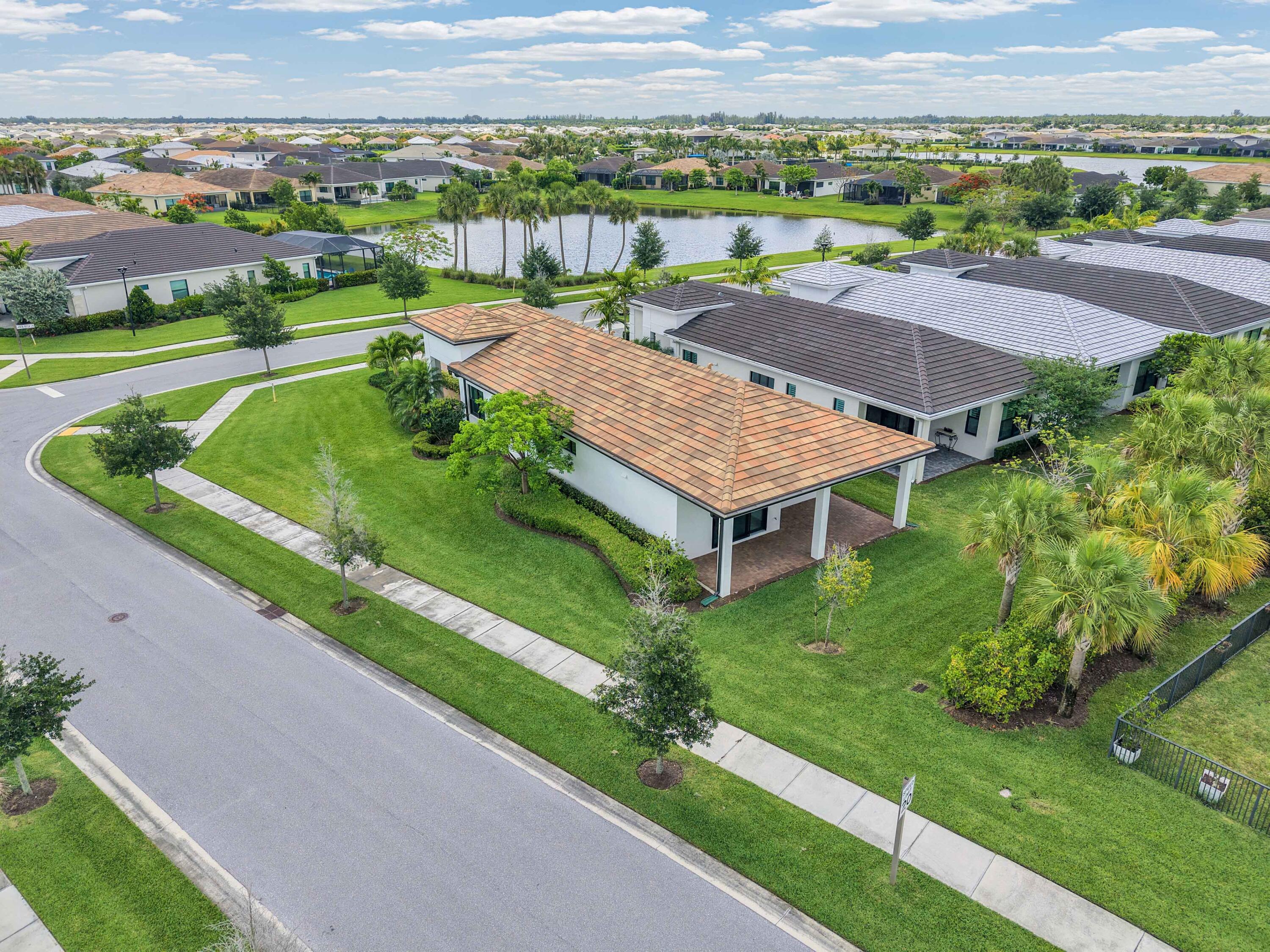 5501 Santa Rosa Lane Westlake, FL 33470 - Photo 27 of 31 an aerial view of a house with a garden