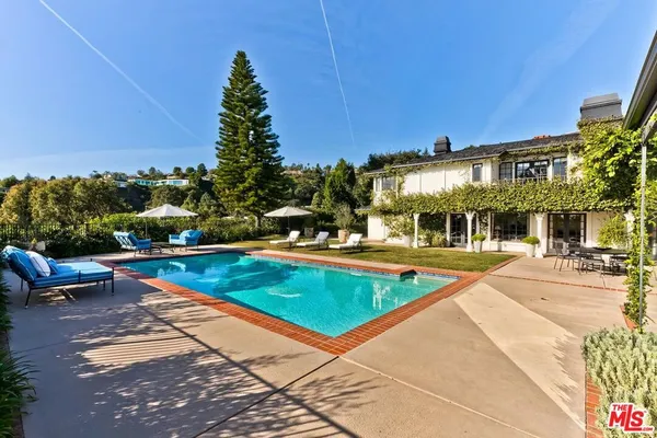 a view of a swimming pool with a patio