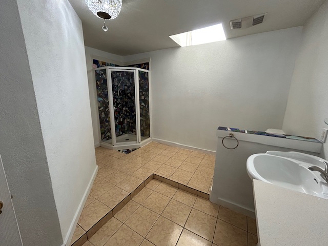 109 North Main Street, Unit A Taylor, TX 76574 - Photo 13 of 17 a bathroom with a bathtub and sink