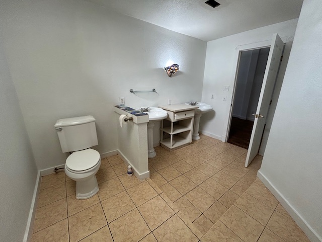 109 North Main Street, Unit A Taylor, TX 76574 - Photo 14 of 17 a spacious bathroom with a toilet and a sink