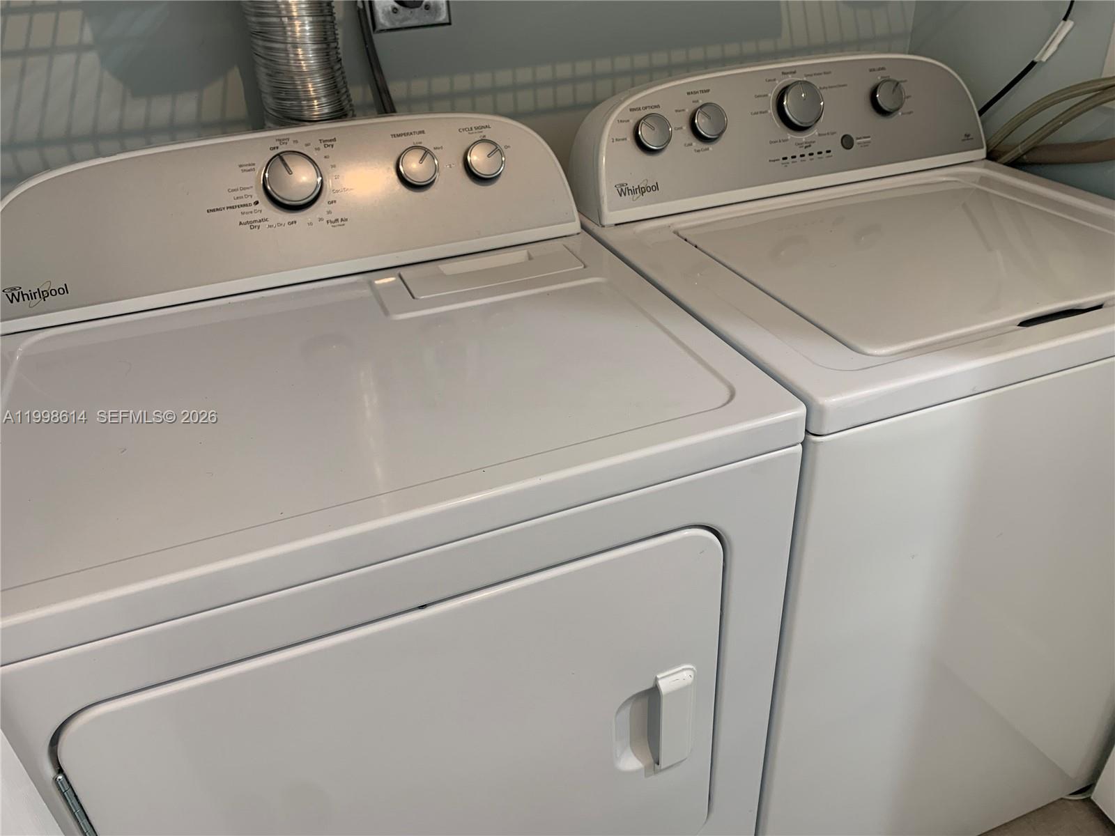 6082 Southeast Landing Way, Unit 10 Stuart, FL 34997 - Photo 12 of 35 a close up view of washer and dryer