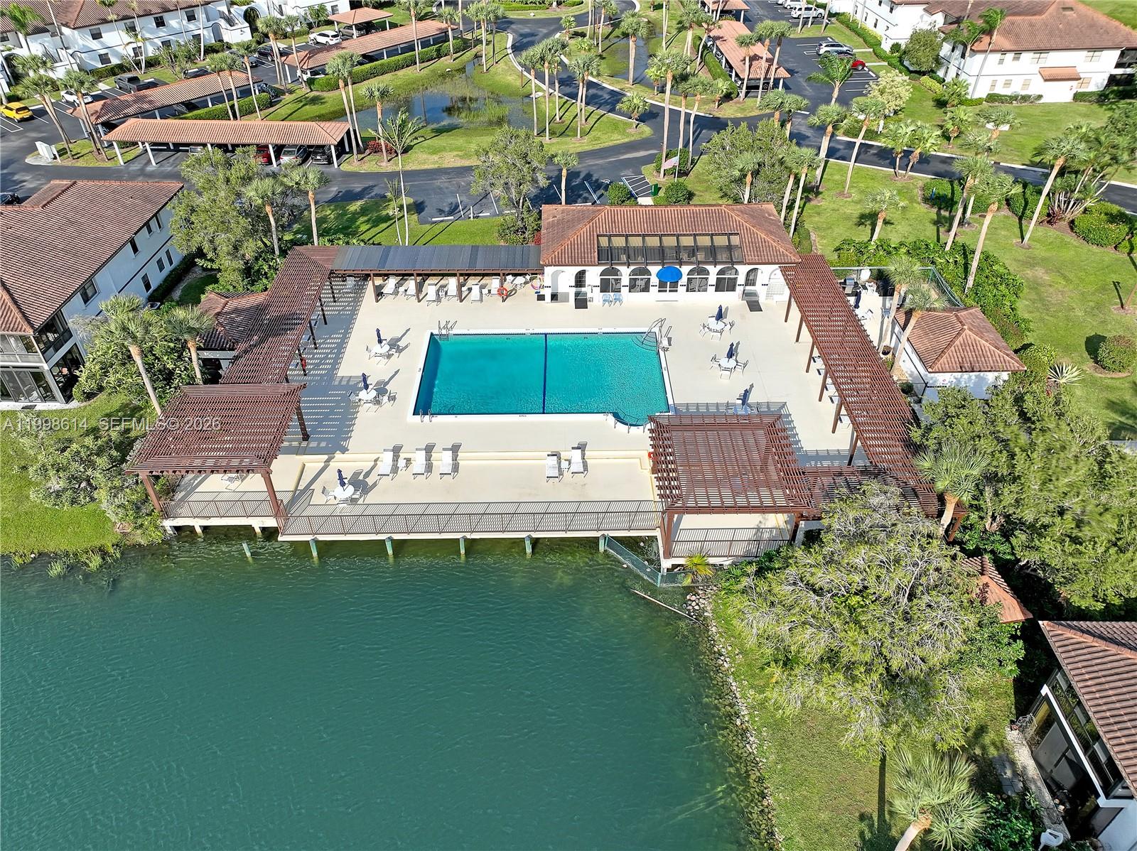 6082 Southeast Landing Way, Unit 10 Stuart, FL 34997 - Photo 27 of 35 an aerial view of a house with a garden