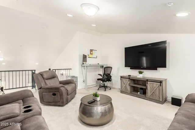 a bedroom with a bed and a ceiling fan