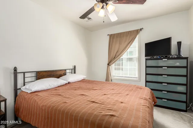 a white toilet sitting next to a bathroom sink