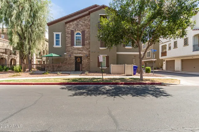 a view of the house with a yard