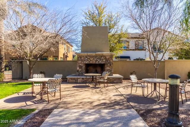 a view of swimming pool with a table and chairs
