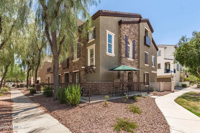 a front view of a building with garden