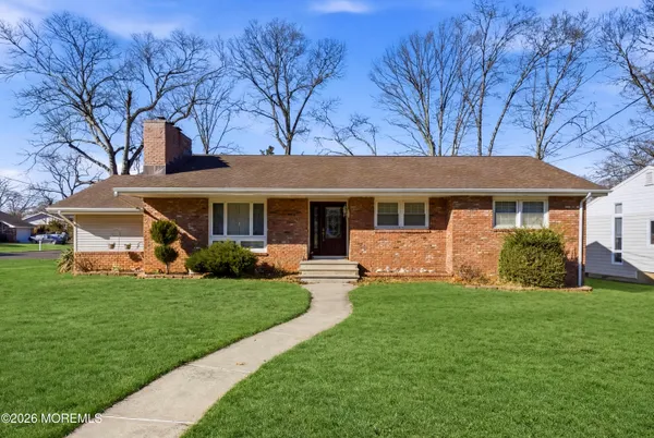 a front view of a house with a garden and porch