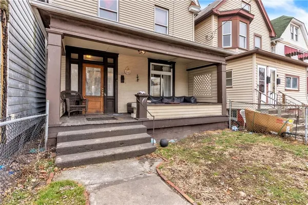 a view of a house with outdoor seating area