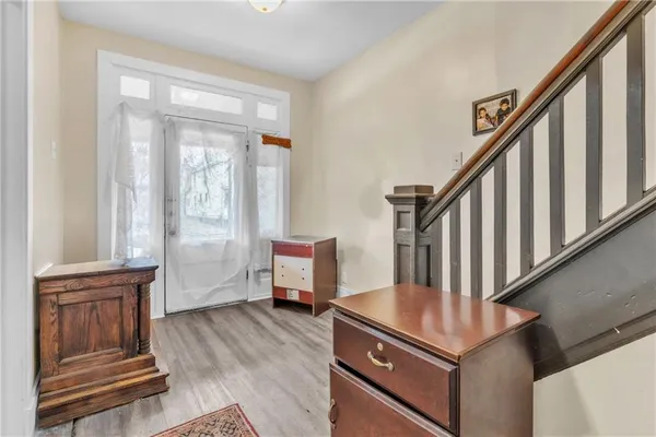 a view of a livingroom with furniture and staircase