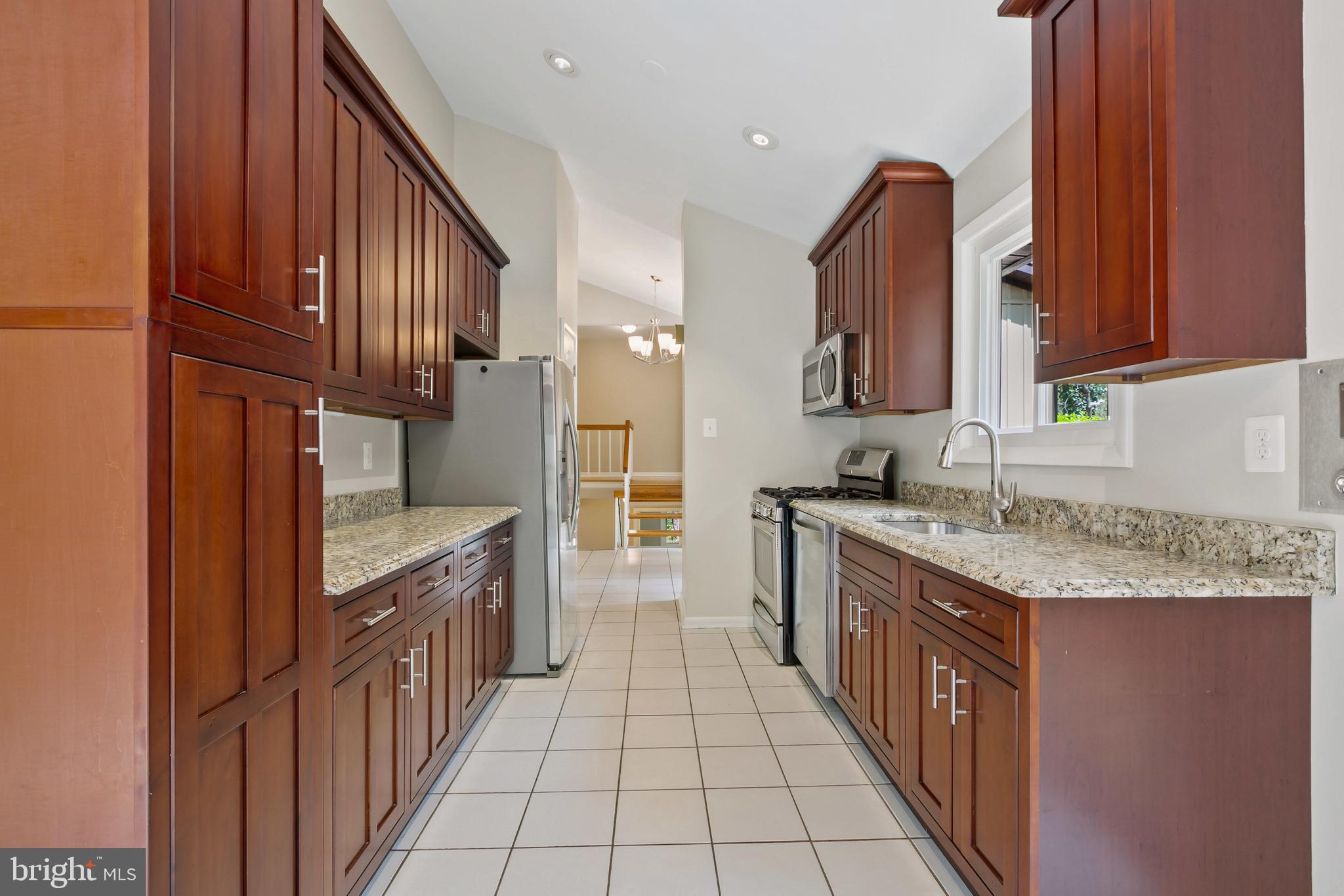 11019 Swansfield Road Columbia, MD 21044 - Photo 14 of 47 Granite counters, stainless appliances.