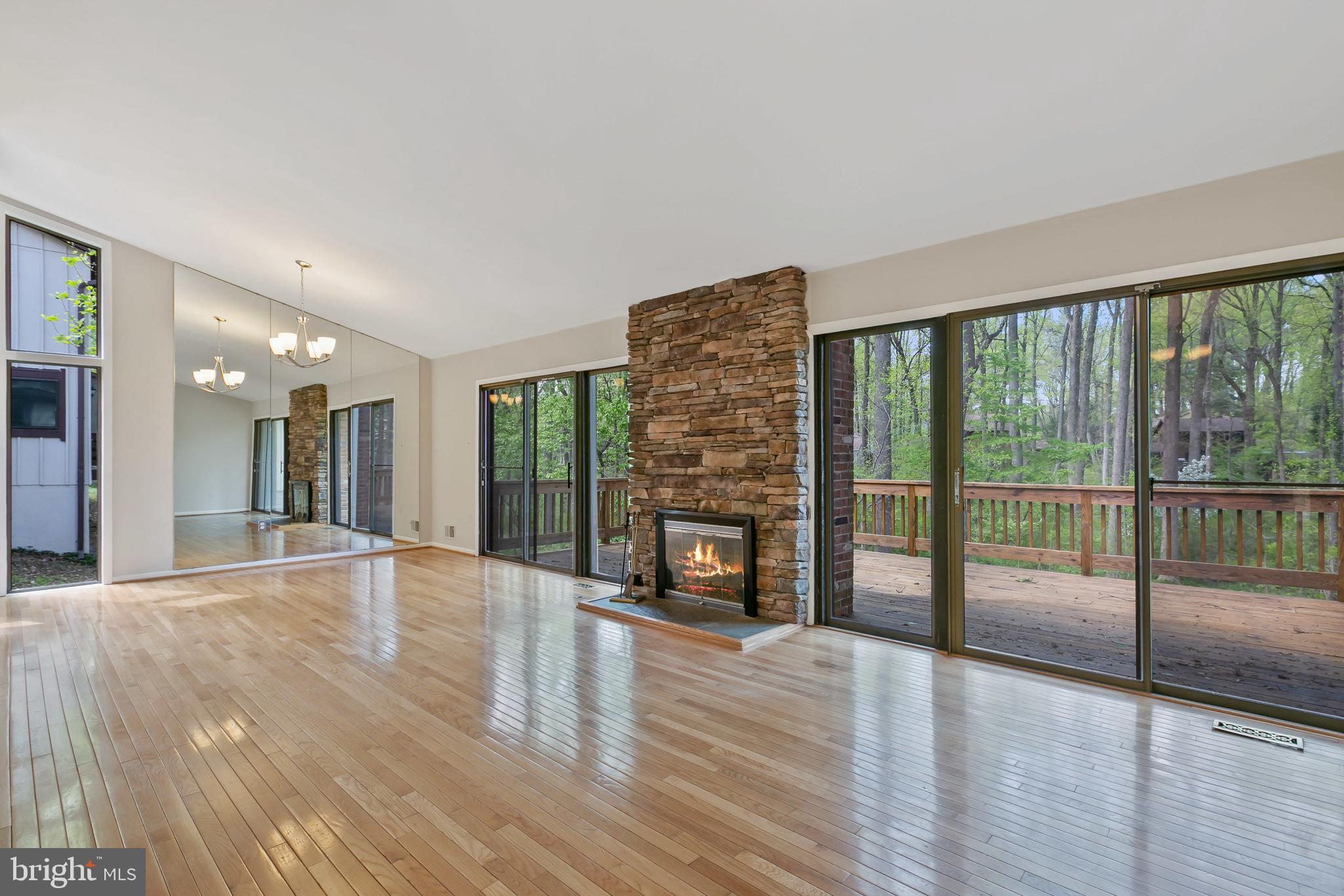 11019 Swansfield Road Columbia, MD 21044 - Photo 6 of 47 Main level great room, hardwood floors, deck.