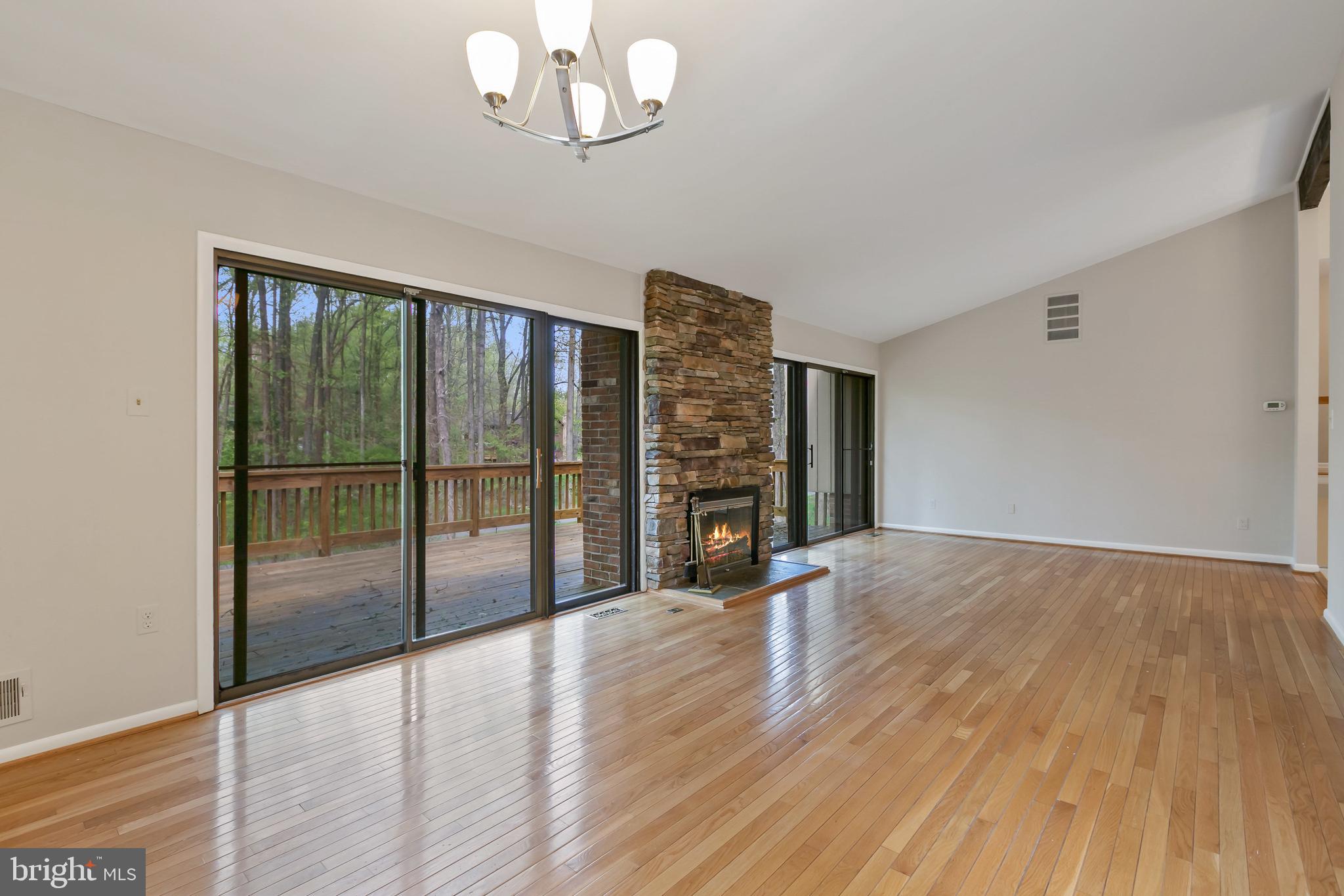 11019 Swansfield Road Columbia, MD 21044 - Photo 7 of 47 Main level great room, stone fireplace.