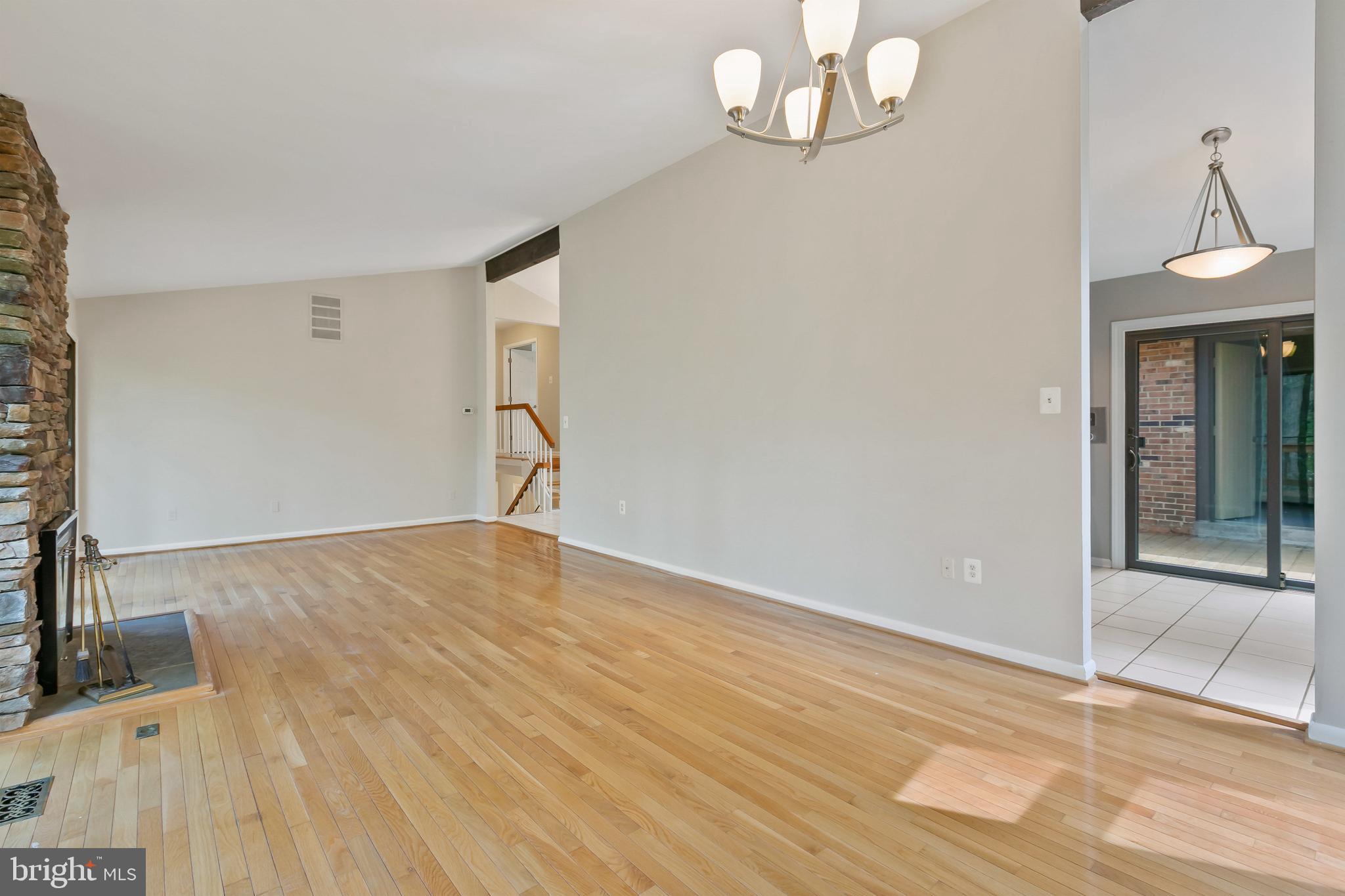 11019 Swansfield Road Columbia, MD 21044 - Photo 8 of 47 Bright, well-lit, open, hardwood floor.