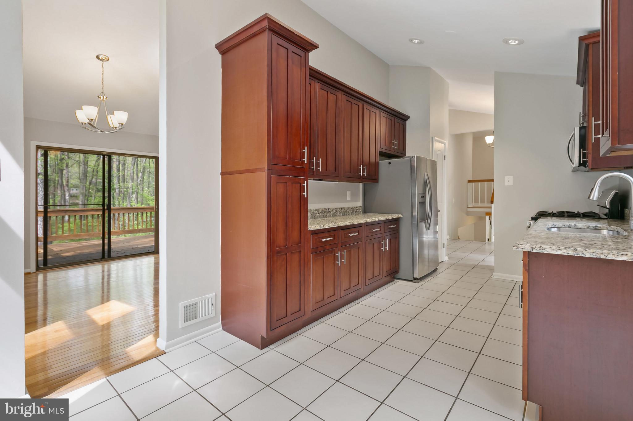 11019 Swansfield Road Columbia, MD 21044 - Photo 9 of 47 Kitchen; custom cabinetry, granite counters.
