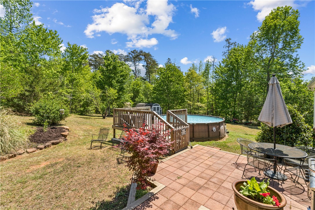 189 Little Choestoea Road Westminster, SC 29693 - Photo 28 of 38 This expansive backyard retreat features a refreshing pool, spacious deck, and inviting patio.