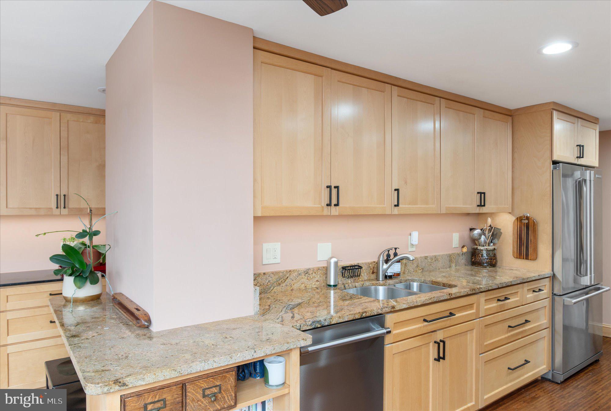 2230 California Street Northwest, Unit 4DW Washington, DC 20008 - Photo 11 of 43 a kitchen with granite countertop white cabinets and white appliances