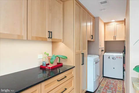 a kitchen with a refrigerator and sink