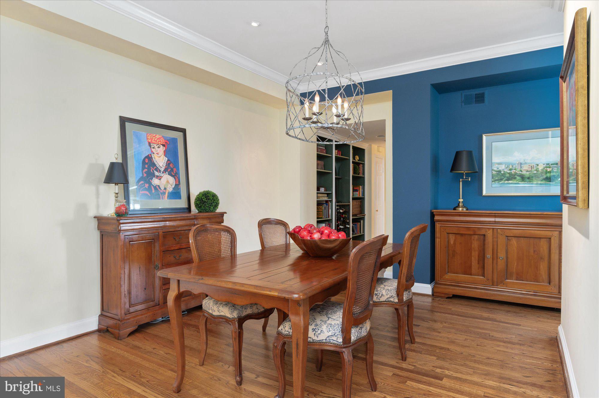2230 California Street Northwest, Unit 4DW Washington, DC 20008 - Photo 14 of 43 a view of a dining room with furniture wooden floor and chandelier