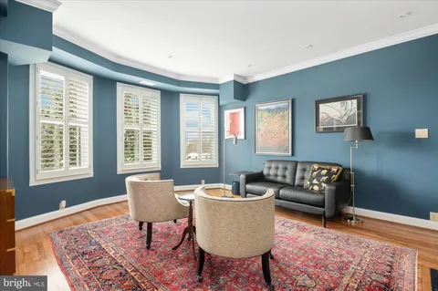 a living room with furniture and a rug