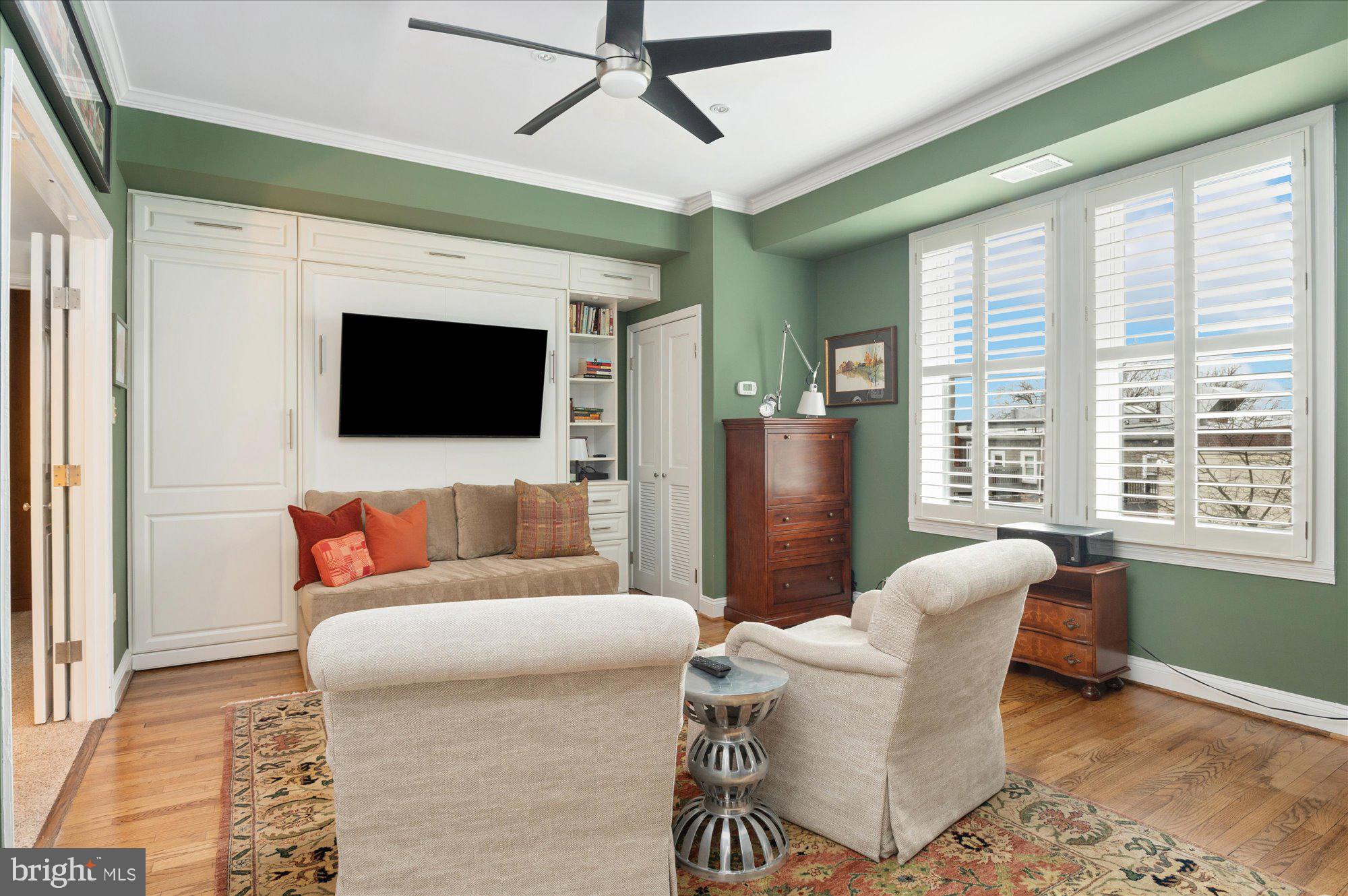 2230 California Street Northwest, Unit 4DW Washington, DC 20008 - Photo 20 of 43 a living room with furniture and a flat screen tv