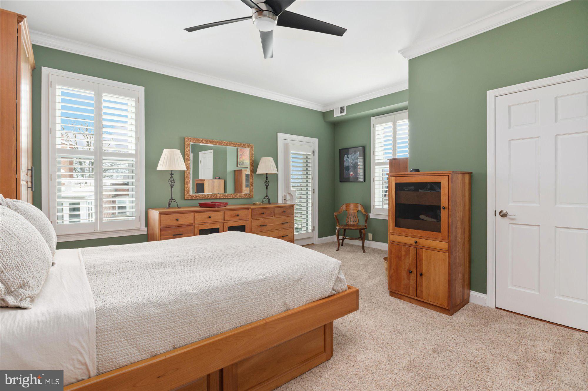 2230 California Street Northwest, Unit 4DW Washington, DC 20008 - Photo 23 of 43 a bedroom with a bed and large windows