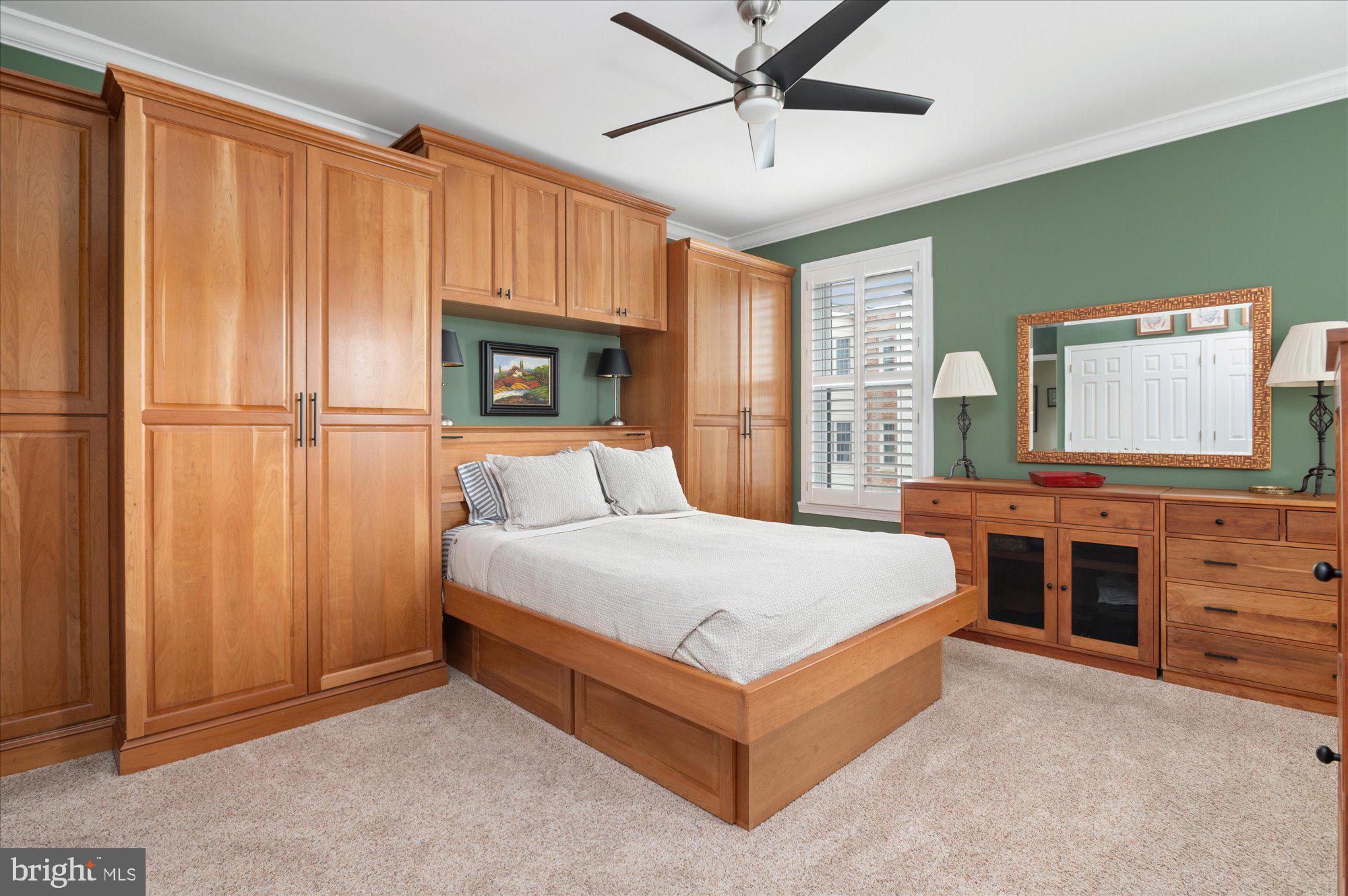 2230 California Street Northwest, Unit 4DW Washington, DC 20008 - Photo 24 of 43 a spacious bedroom with a bed and a dresser