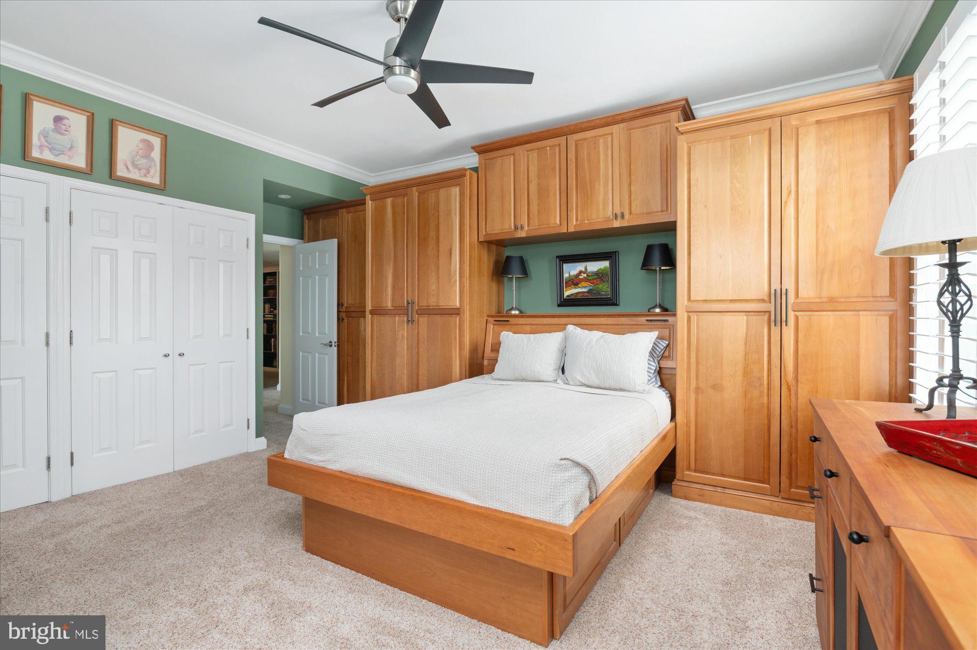 2230 California Street Northwest, Unit 4DW Washington, DC 20008 - Photo 25 of 43 a spacious bedroom with a bed and a chandelier