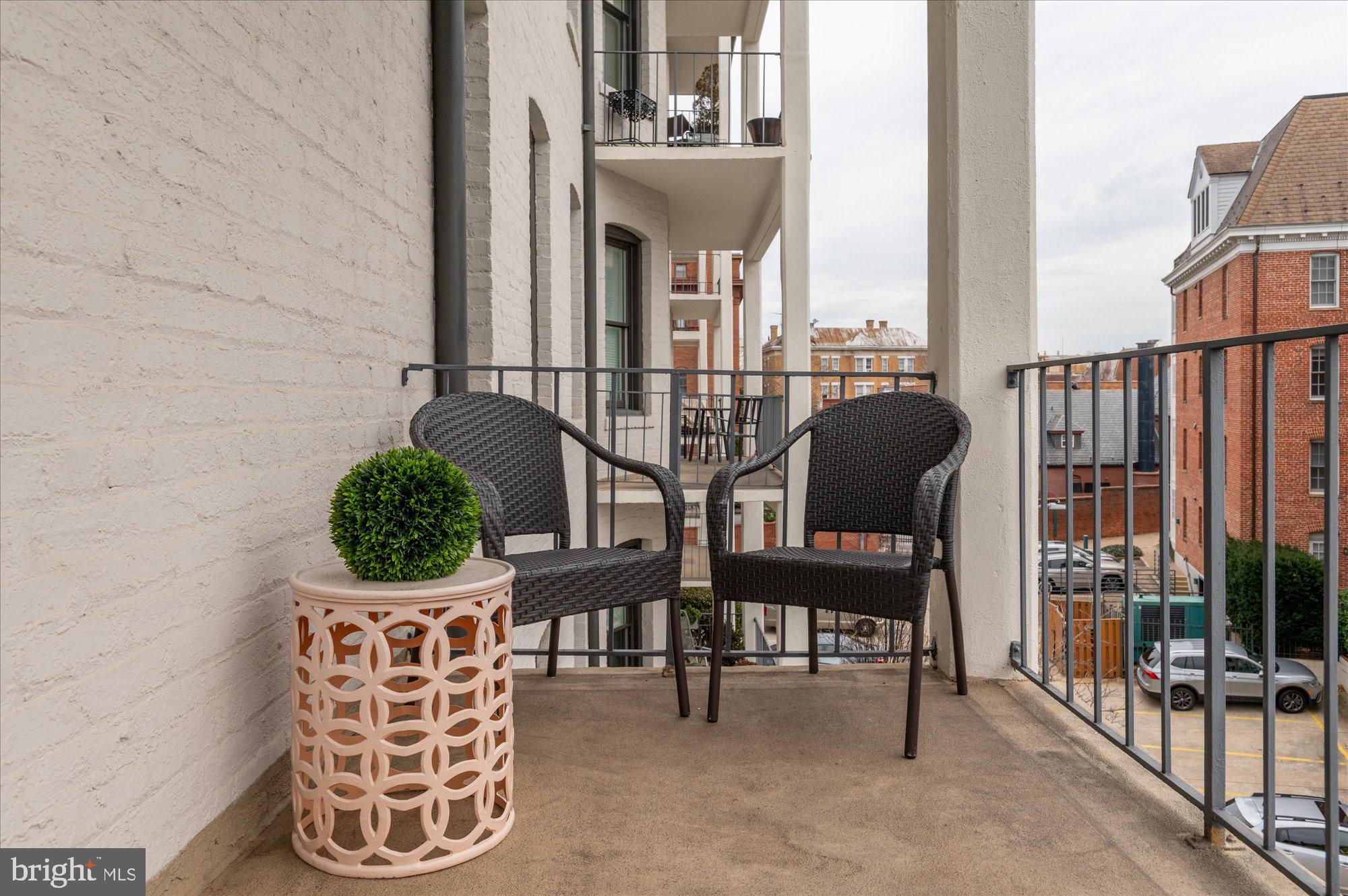 2230 California Street Northwest, Unit 4DW Washington, DC 20008 - Photo 30 of 43 a view of balcony with couple of chairs