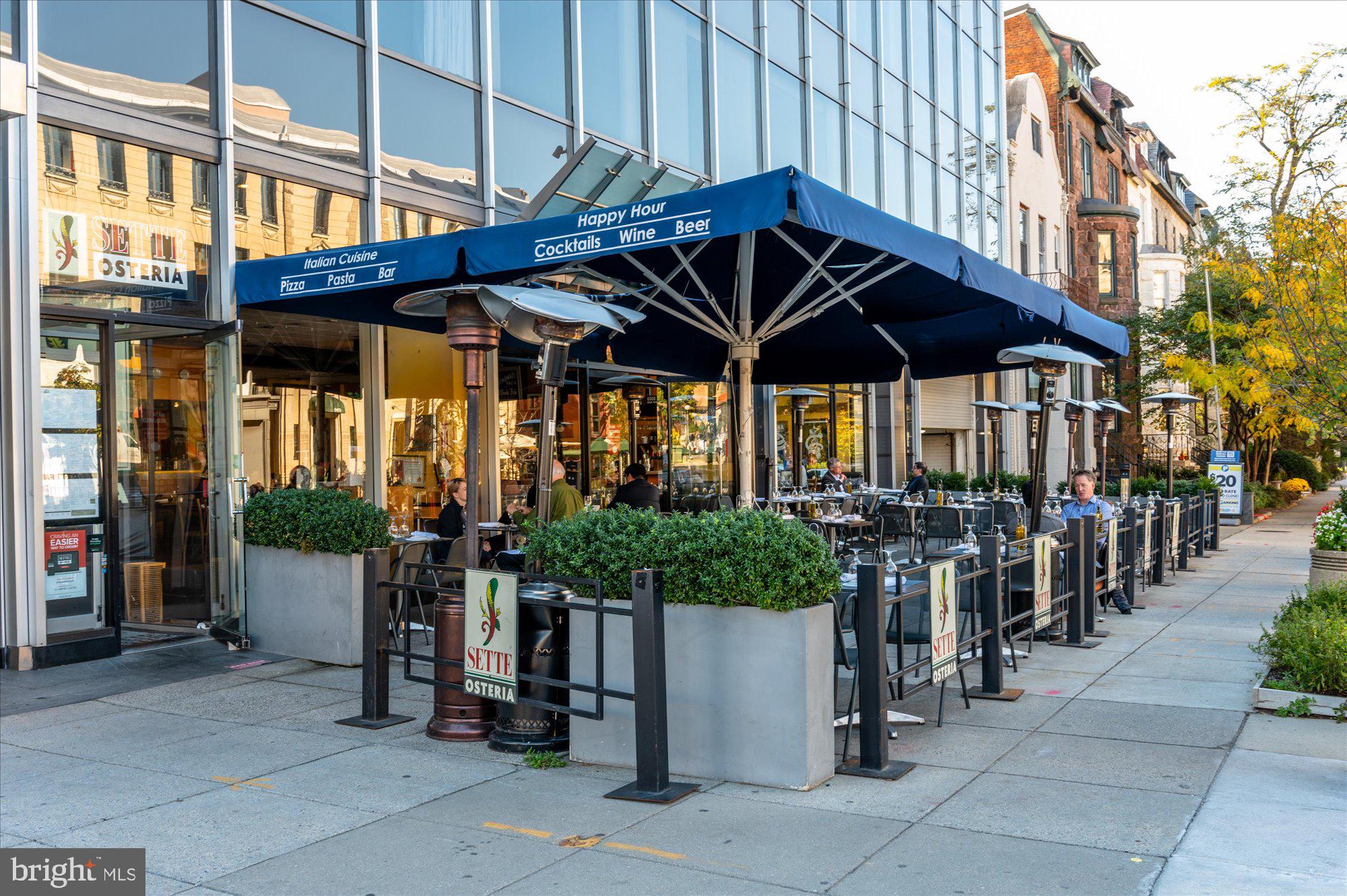 2230 California Street Northwest, Unit 4DW Washington, DC 20008 - Photo 42 of 43 a group of people sitting under an umbrella
