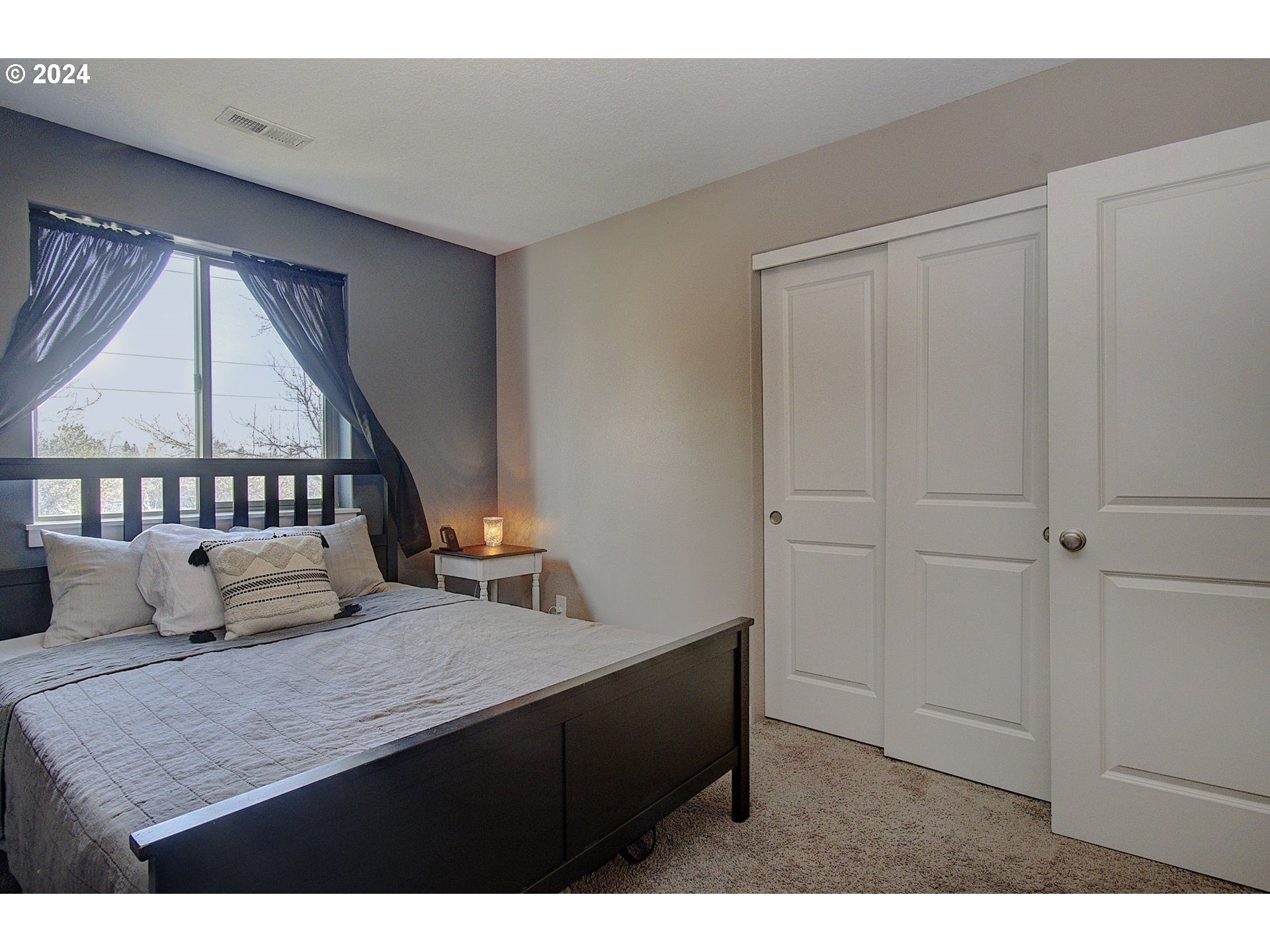 146 North 44th Place Ridgefield, WA 98642 - Photo 19 of 30 a bedroom with a bed and a window