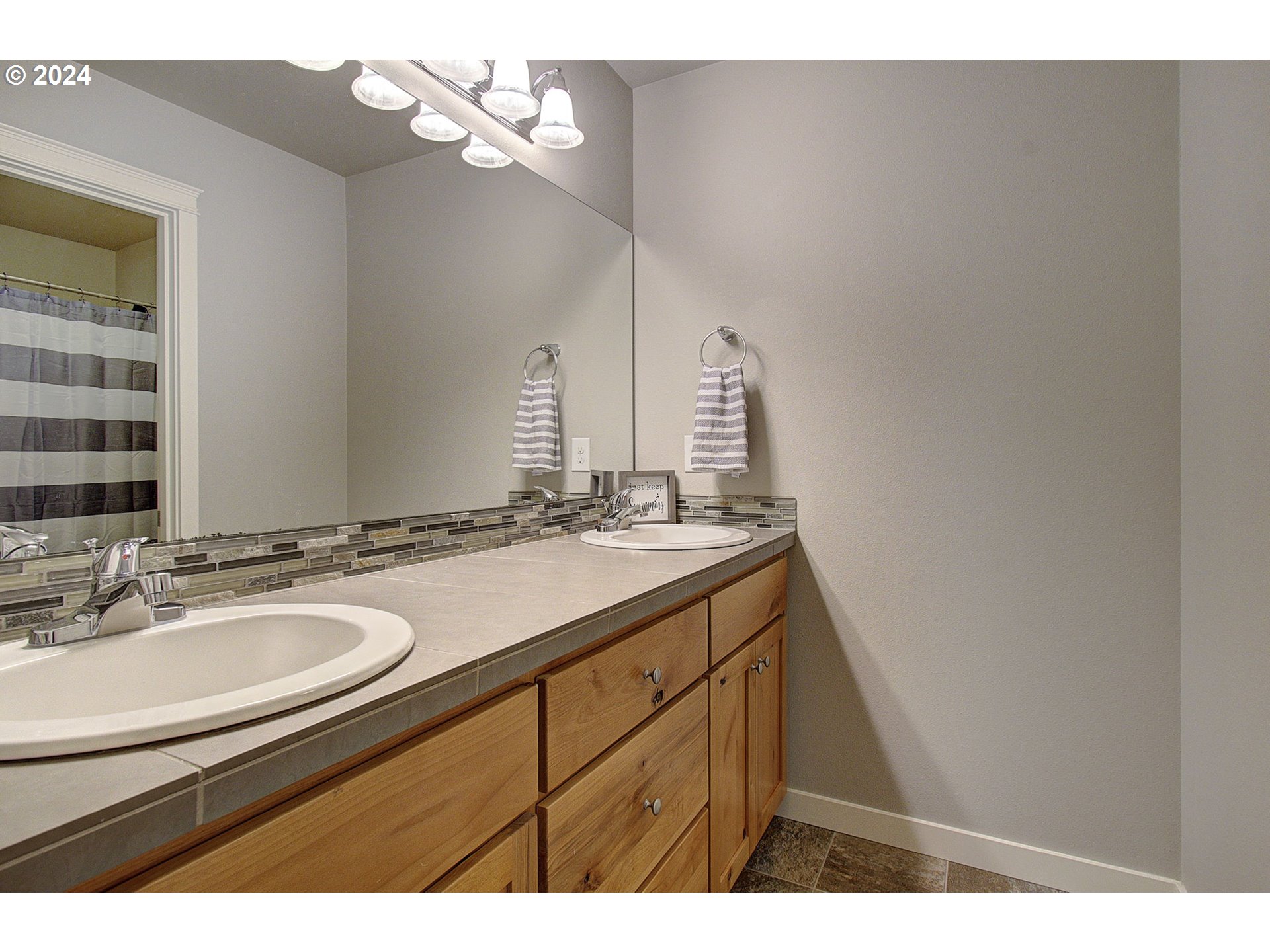 146 North 44th Place Ridgefield, WA 98642 - Photo 20 of 30 a bathroom with a sink and a mirror