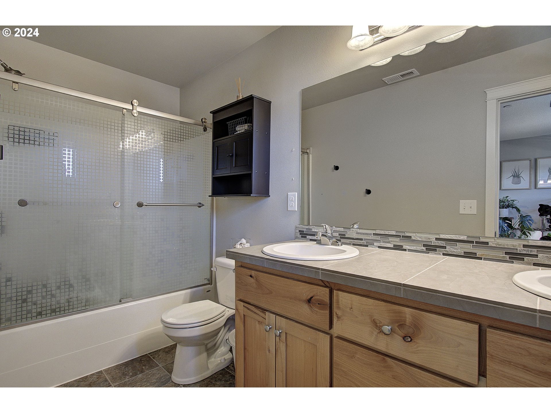 146 North 44th Place Ridgefield, WA 98642 - Photo 28 of 30 a bathroom with a granite countertop sink toilet a mirror and shower