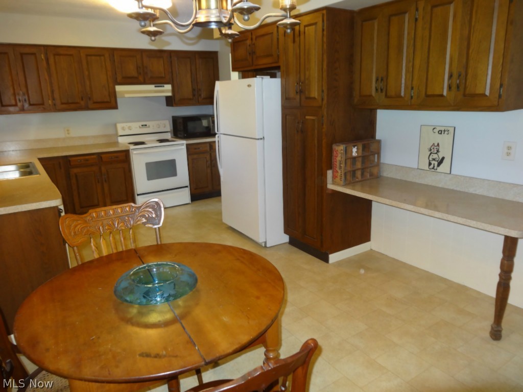 4555 Beat Road Litchfield, OH 44253 - Photo 9 of 20 Another view of the kitchen with planning desk.