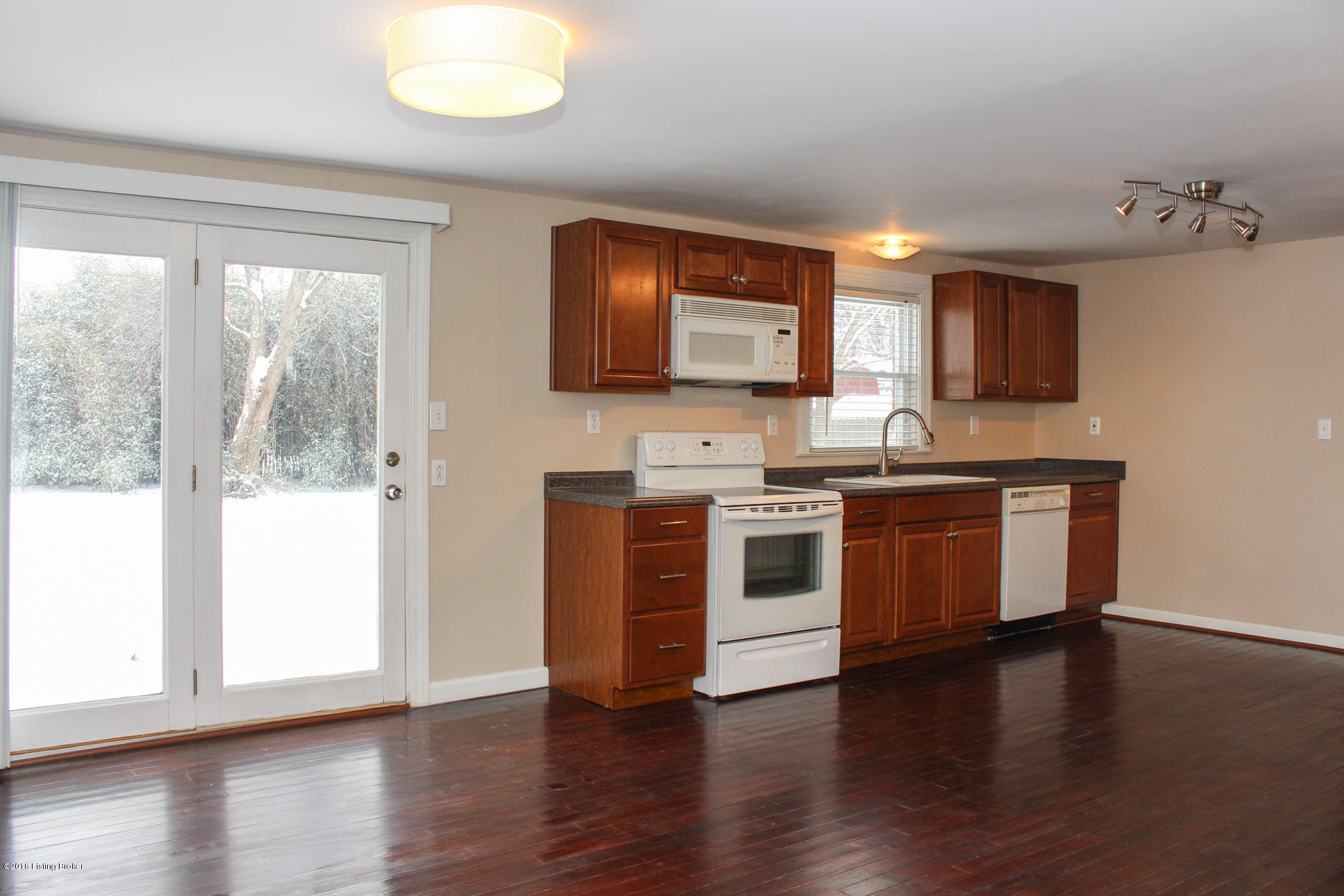 4628 Dover Road Louisville, KY 40216 - Photo 8 of 27 kitchen is large and open, easy access to deck