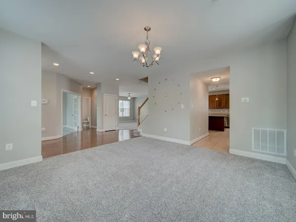 a view of empty room with a fireplace