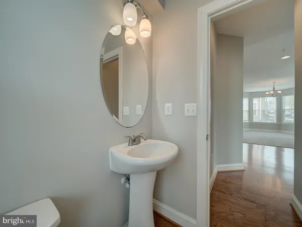 a bathroom with a sink vanity and a mirror