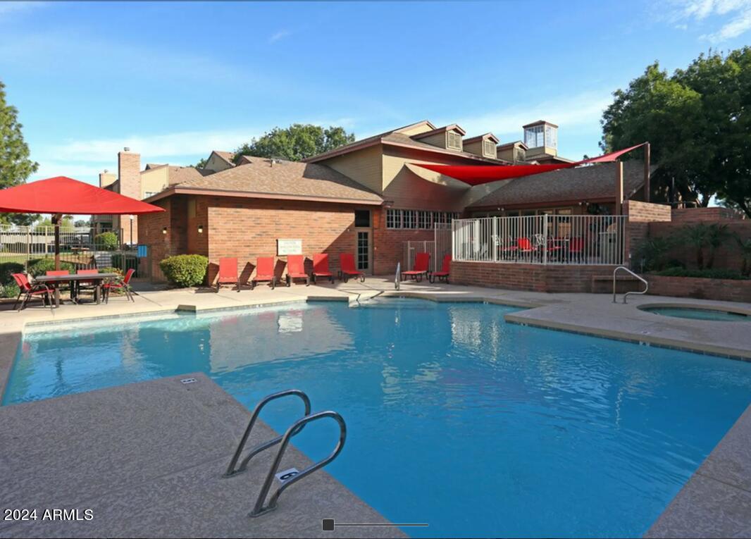8902 North 19th Avenue, Unit A2 Phoenix, AZ 85021 - Photo 6 of 10 a view of a house with pool and chairs