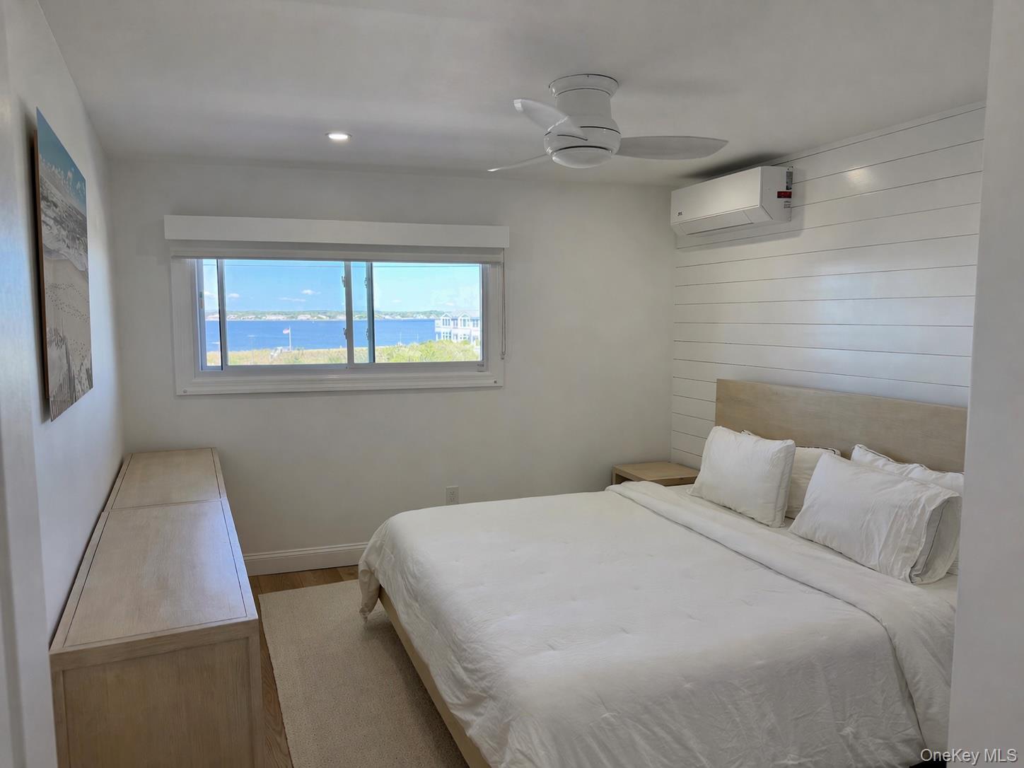 585 Dune Road, Unit B1012 Westhampton, NY 11978 - Photo 4 of 11 a bedroom with a bed and a window