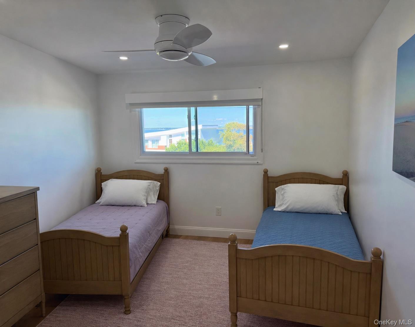 585 Dune Road, Unit B1012 Westhampton, NY 11978 - Photo 8 of 11 a bedroom with furniture and a window
