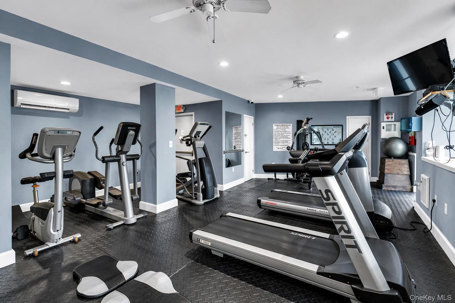 585 Dune Road, Unit B1012 Westhampton, NY 11978 - Photo 9 of 11 a view of a room with gym equipment